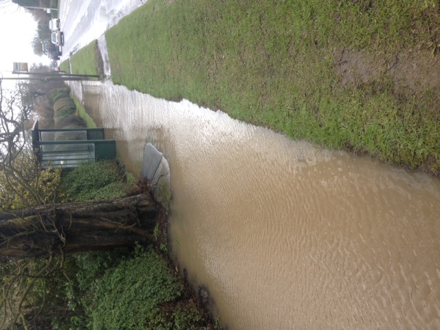 Photo of flooding at bus stop on A6 near Gubberford Lane 